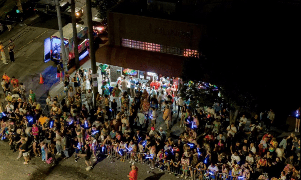 Large crowd waiting outside the entrance to Al's on 7th Nightclub